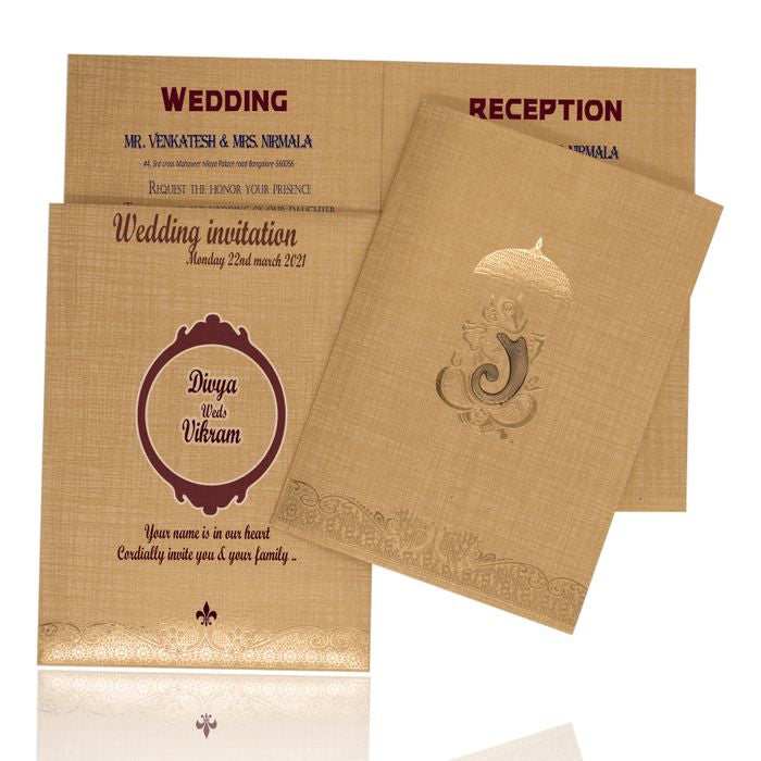 Selling Brown gold metalic envelope with umbrella print and sund ganesha sticker invitation card online. Buying invitation cards made easy with King of Cards! &