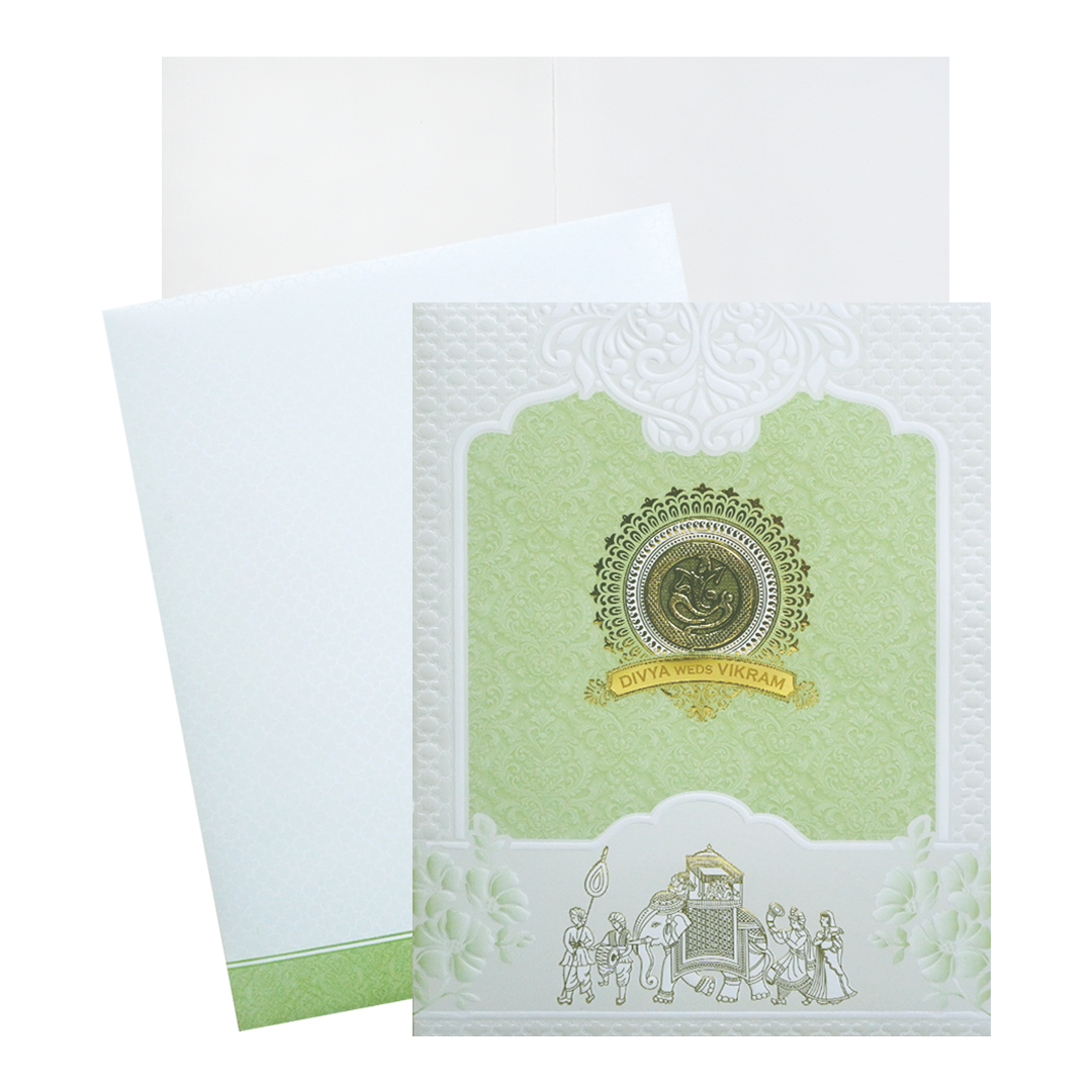 Green and White Bhaarat Wedding Card featuring a ganesha sticker, an acrylic nameplate embossed design and gold foiled bhaarat. It also includes a folded insert and an envelope. Shop now! ?WhatsApp Support ?Express Delivery.