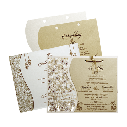 Shop White Floral Laser Cut Wedding Card with detailed floral cutwork, gold insert, nameplate, and coordinated envelope. ?WhatsApp Support ?Express Delivery.
