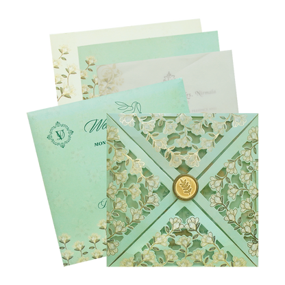 Green fancy wedding card features laser cut opening with tracing sheet and two inserts and an envelope. Shipping and printing charges are extra.