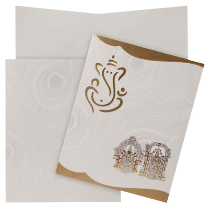 This wedding card is a designer card with a pristine white shading. This card has laser cut Ganesha with Balaji and padhmavathi at the bottom corner. This card has golden shading at the corners which makes the card looks awesome. This card is a vertical sort card with a traditional opening. As a standard offering, this card has a cover and a single solitary insert. Make your wedding fabulous with this card.