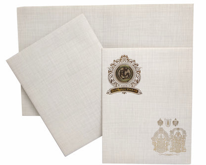 This popular design invitation card presents a gold foiling design at the top left with round embossed Ganesha sticker with bride and groom name plate in acrylic.